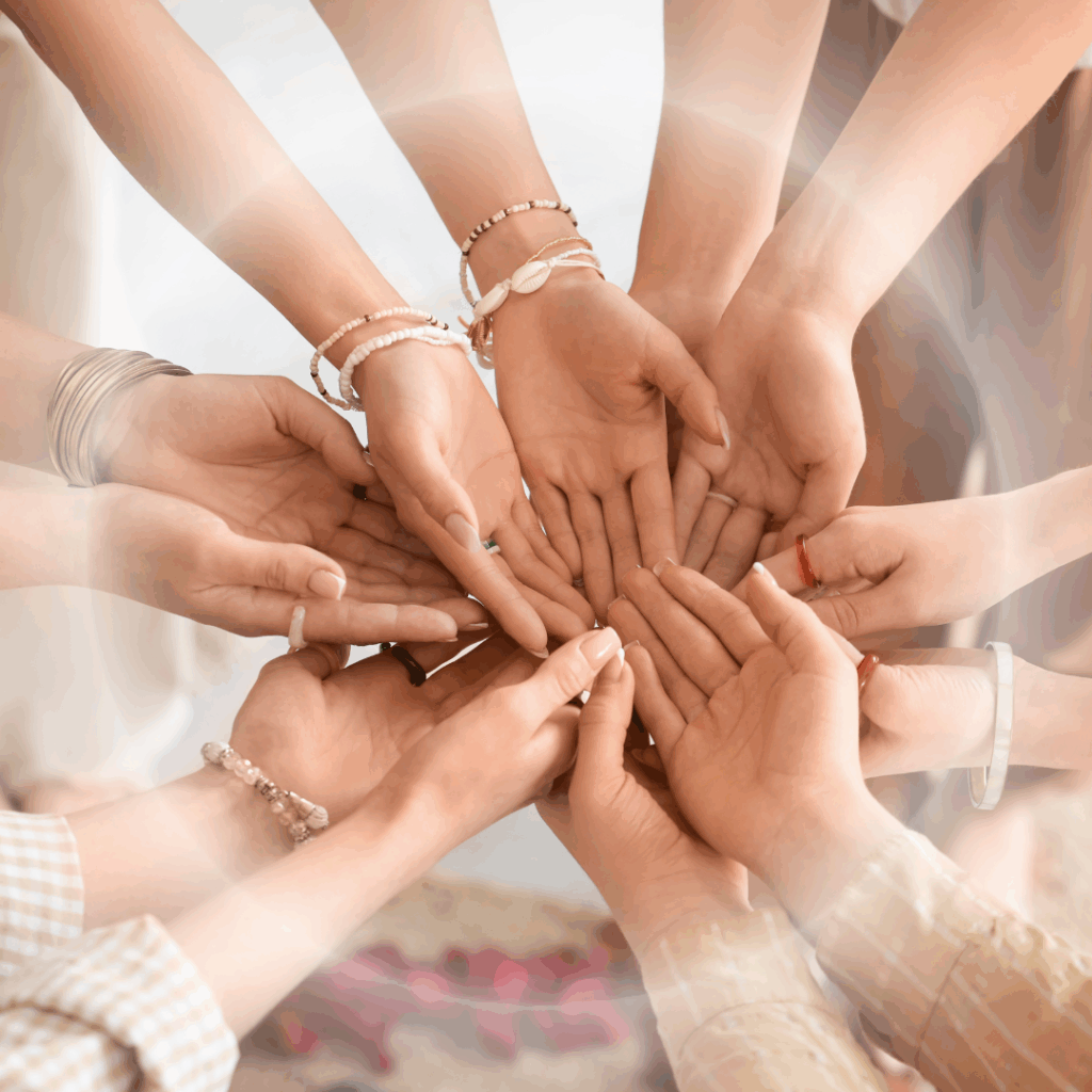 community circle of hands that are surrounded by light